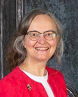 Picture of woman wearing glasses and a red sweater.